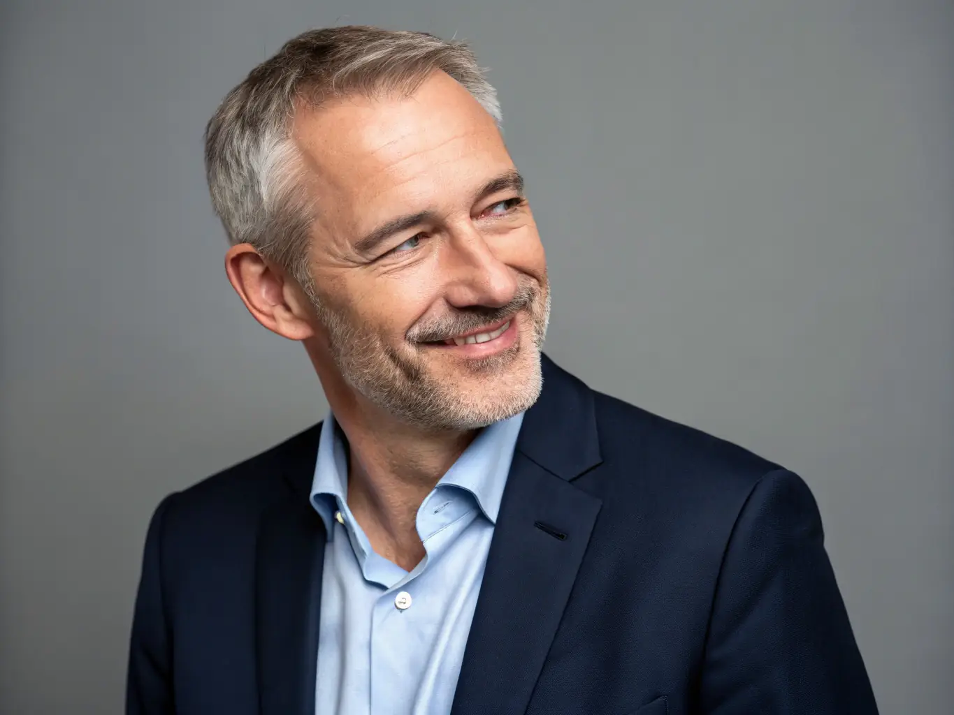 A professional headshot of Professor James Brown, an expert in sustainable business practices, looking thoughtful. He is a featured speaker at the Convectionly conference.